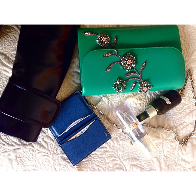 A few fashion week essentials: A plastic coat from @miumiu perfect for this weather, rain or slight chill.  @dior clutch, a pop of color and sparkle will jazz up any dull outfit. My old faithful Valextra credit-card holder and @lamerofficial mist and concentrate for instant reset. #editorinchic